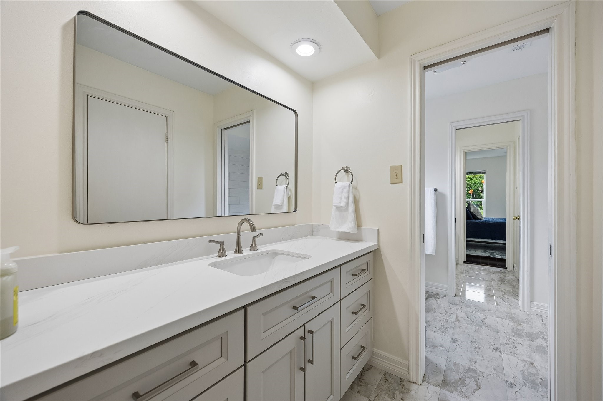 306 Gessner Road Bunker Hill Village, TX 77024 - Photo 26 of 41 Remodeled Hollywood bathrooms with new vanity and quartz counter top.