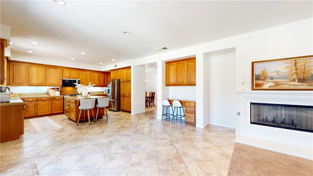 1279 Longbranch Road San Jacinto, CA 92582 - Photo 5 of 35 a living room with furniture and a kitchen area
