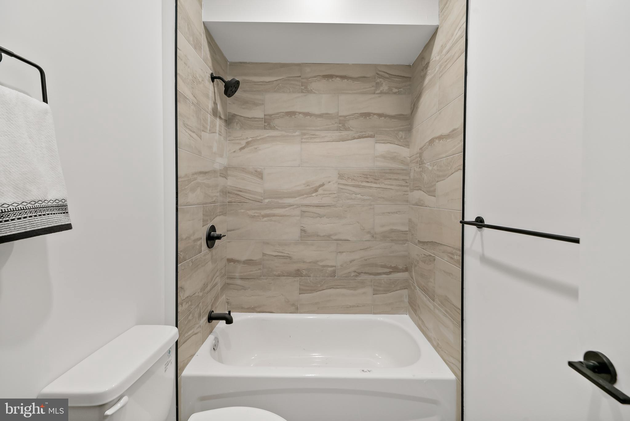 3845 North Broad Street, Unit 3F Philadelphia, PA 19140 - Photo 11 of 19 a bathroom with a bathtub