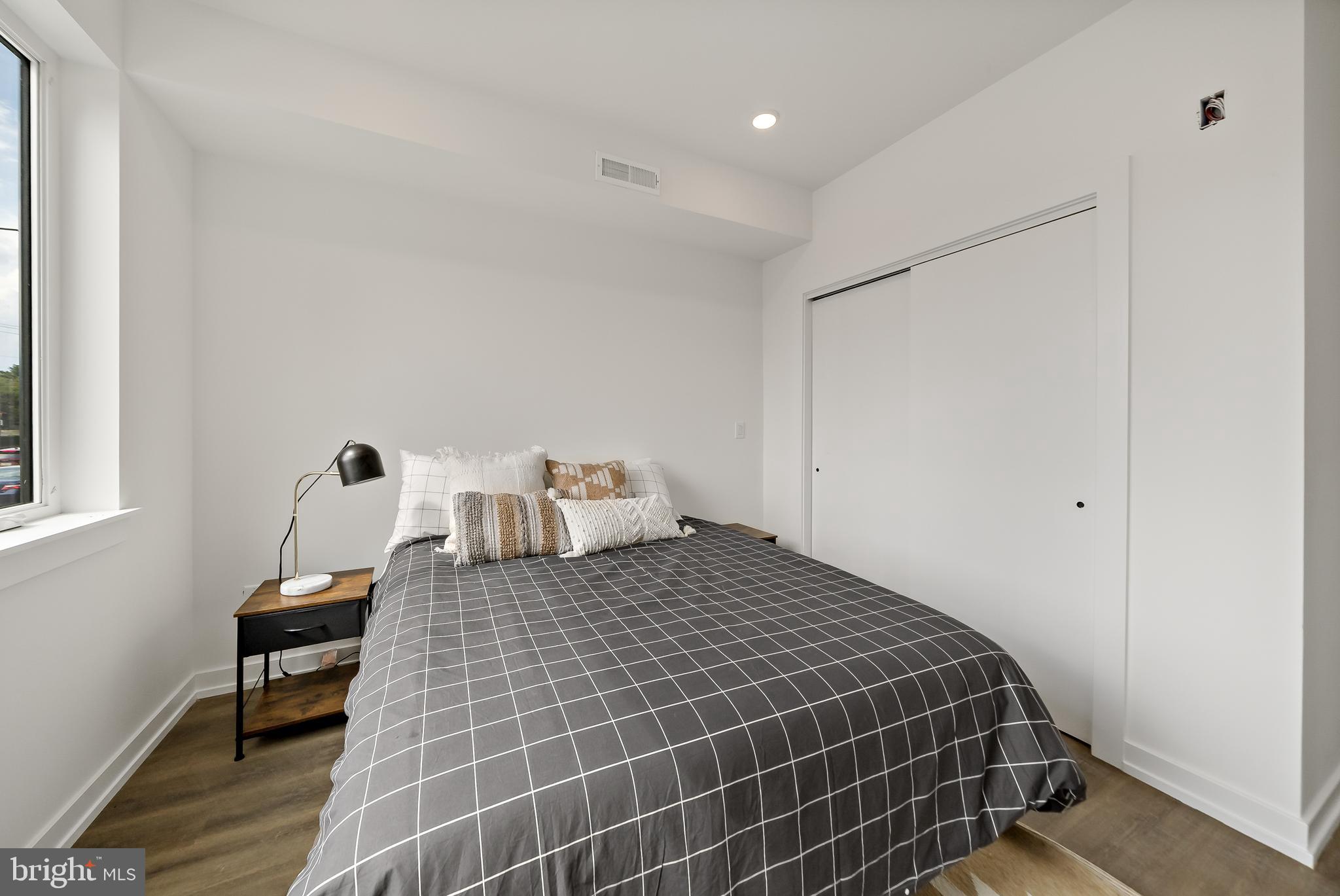 3845 North Broad Street, Unit 3F Philadelphia, PA 19140 - Photo 13 of 19 a bedroom with a bed and chair