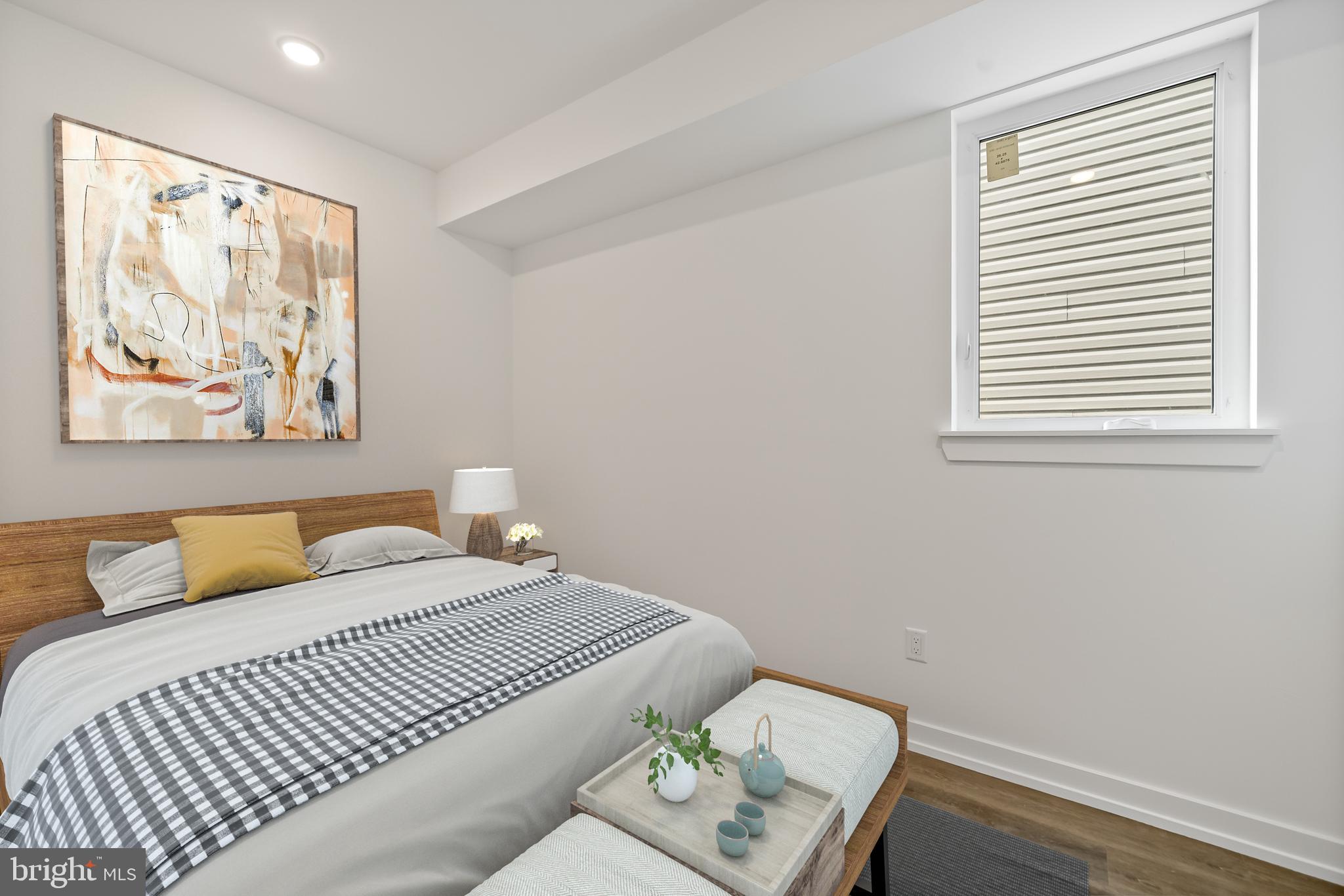 3845 North Broad Street, Unit 3F Philadelphia, PA 19140 - Photo 15 of 19 a bedroom with a bed and a window