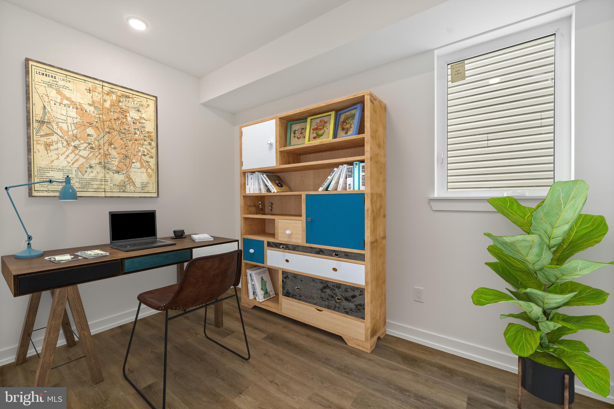 3845 North Broad Street, Unit 3F Philadelphia, PA 19140 - Photo 16 of 19 a workspace with furniture and a potted plant