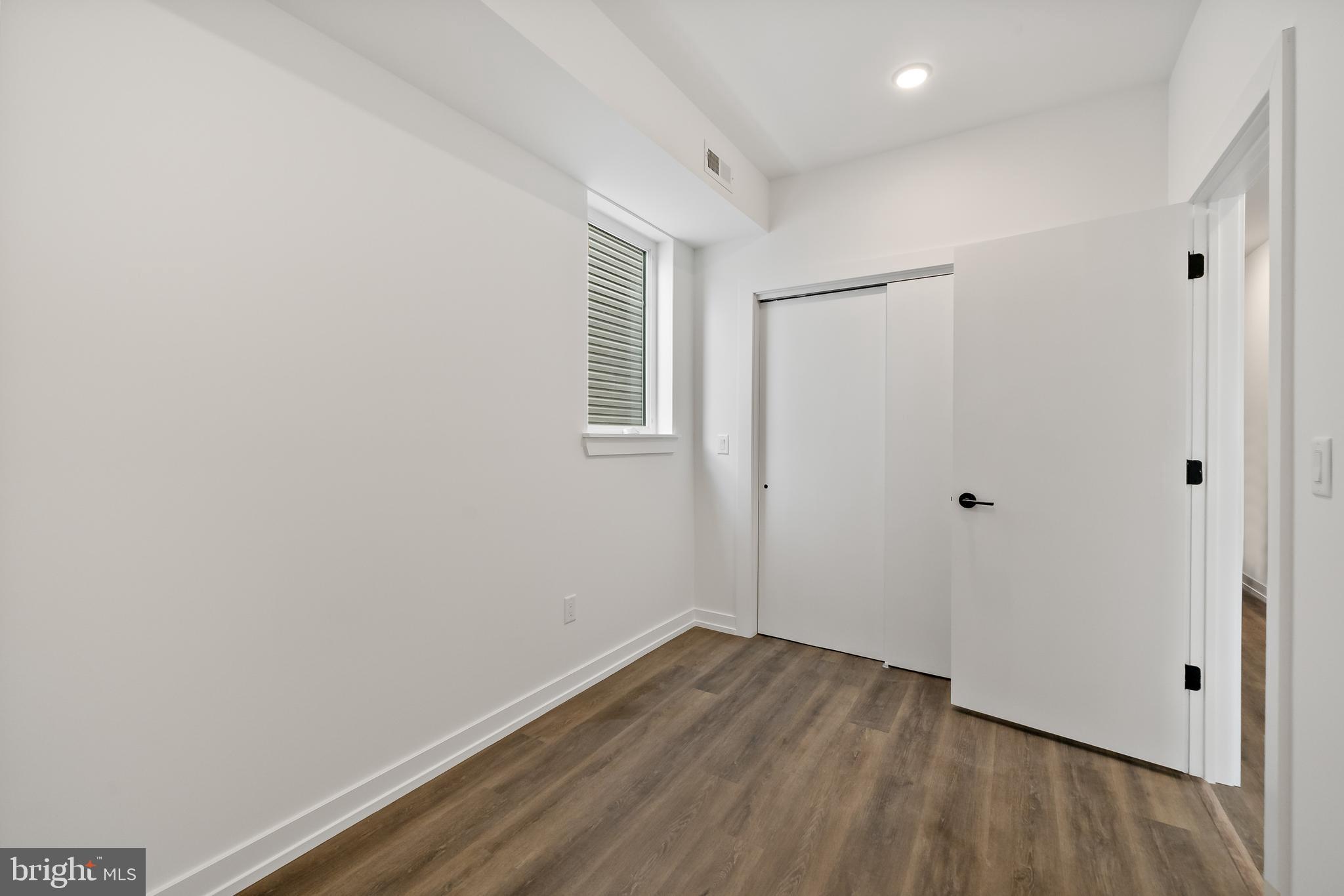 3845 North Broad Street, Unit 3F Philadelphia, PA 19140 - Photo 17 of 19 a view of a room with wooden floor