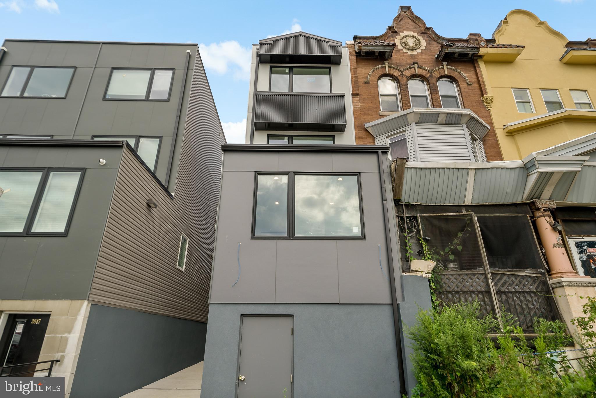 3845 North Broad Street, Unit 3F Philadelphia, PA 19140 - Photo 19 of 19 a front view of a house with balcony