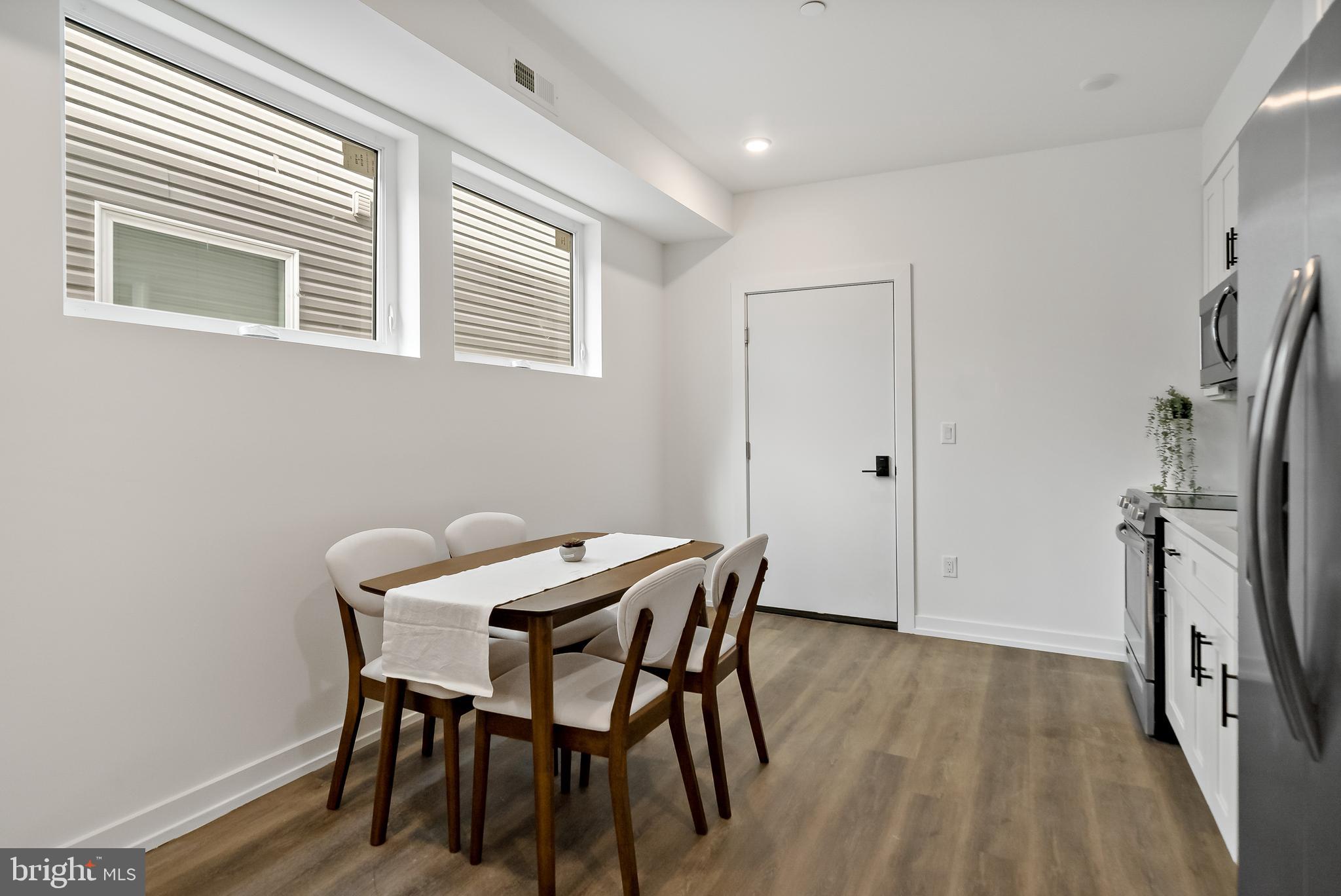3845 North Broad Street, Unit 3F Philadelphia, PA 19140 - Photo 4 of 19 a view of a dining room with furniture and a window