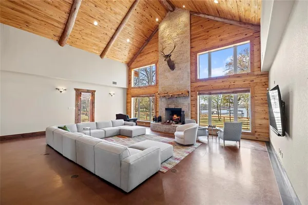 a living room with furniture fireplace and a flat screen tv