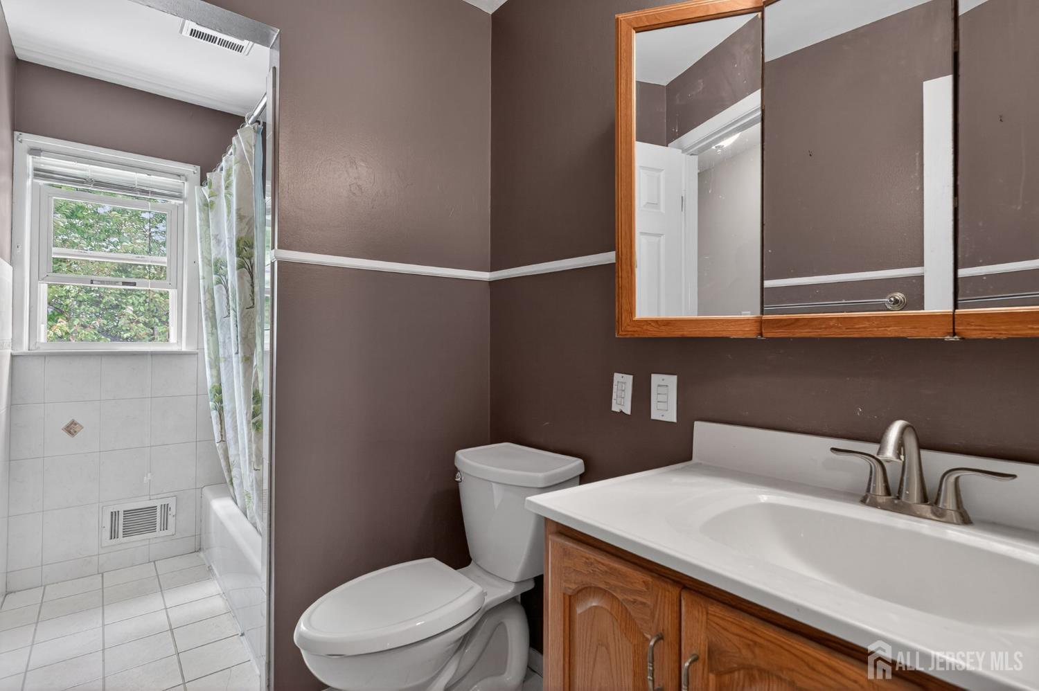 24 Moryan Road Edison, NJ 08817 - Photo 14 of 33 a bathroom with a sink a toilet and shower
