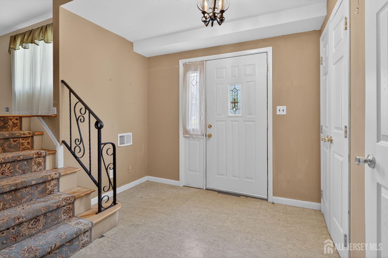 24 Moryan Road Edison, NJ 08817 - Photo 2 of 33 a view of an entryway with staircase