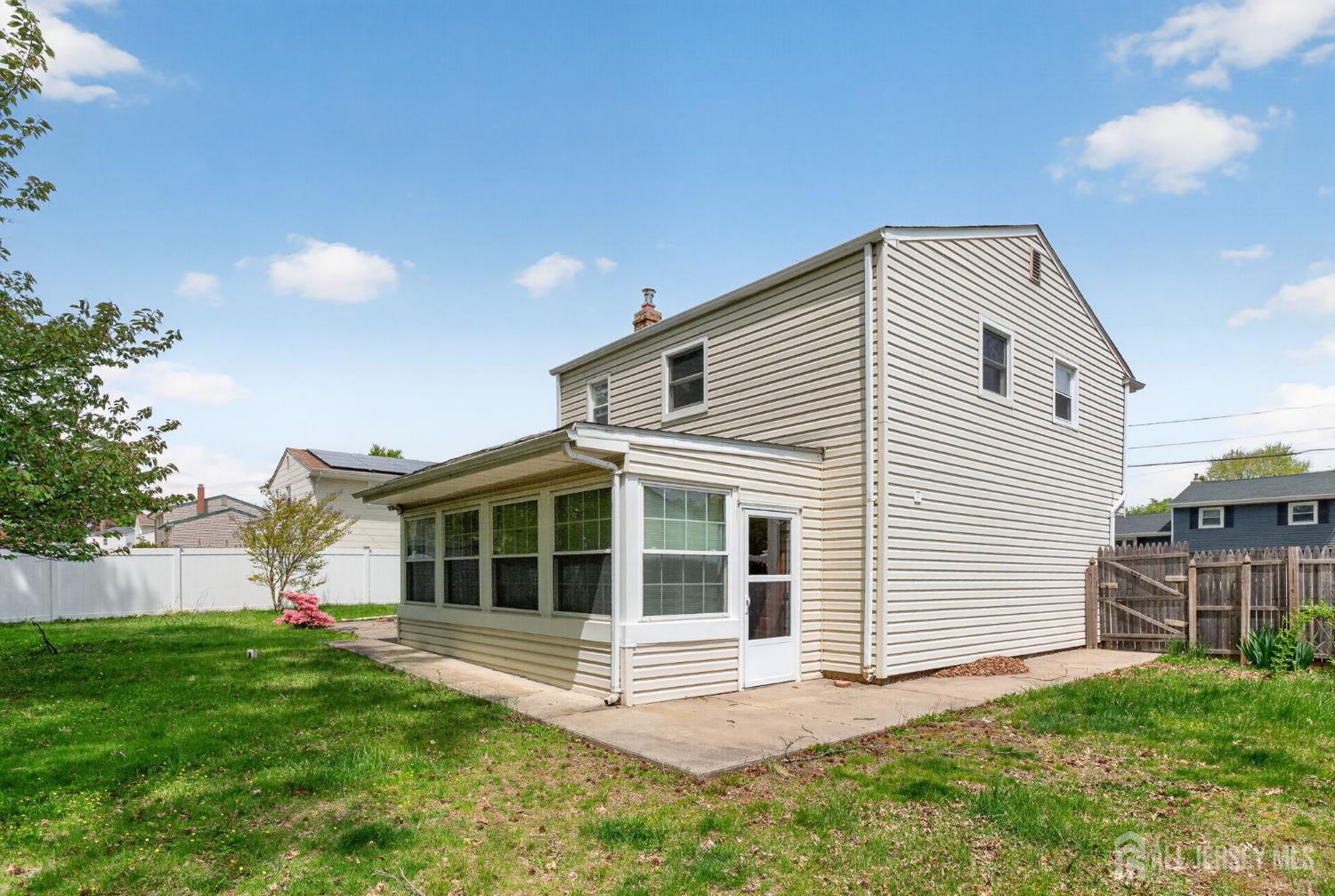 24 Moryan Road Edison, NJ 08817 - Photo 22 of 33 a front view of a house with a yard and garage