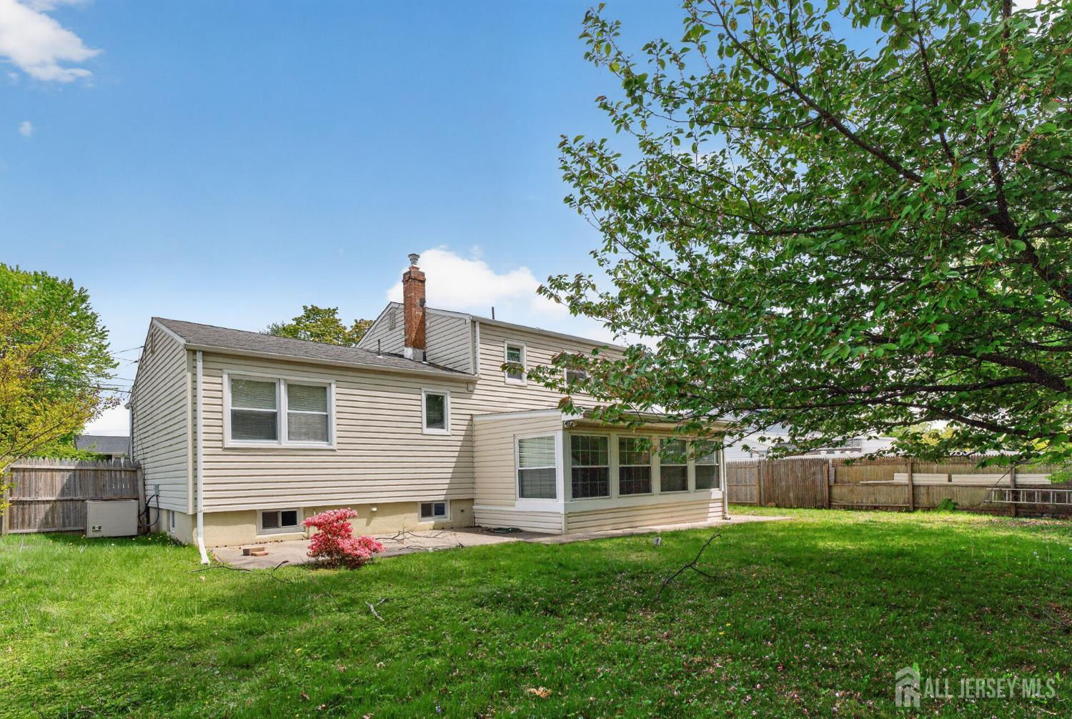 24 Moryan Road Edison, NJ 08817 - Photo 23 of 33 a front view of a house with a garden