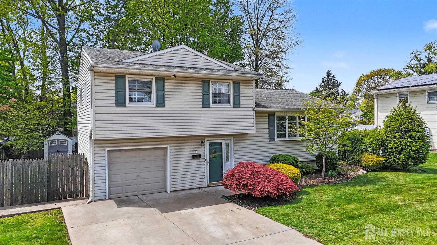 24 Moryan Road Edison, NJ 08817 - Photo 26 of 33 a front view of a house with a garden