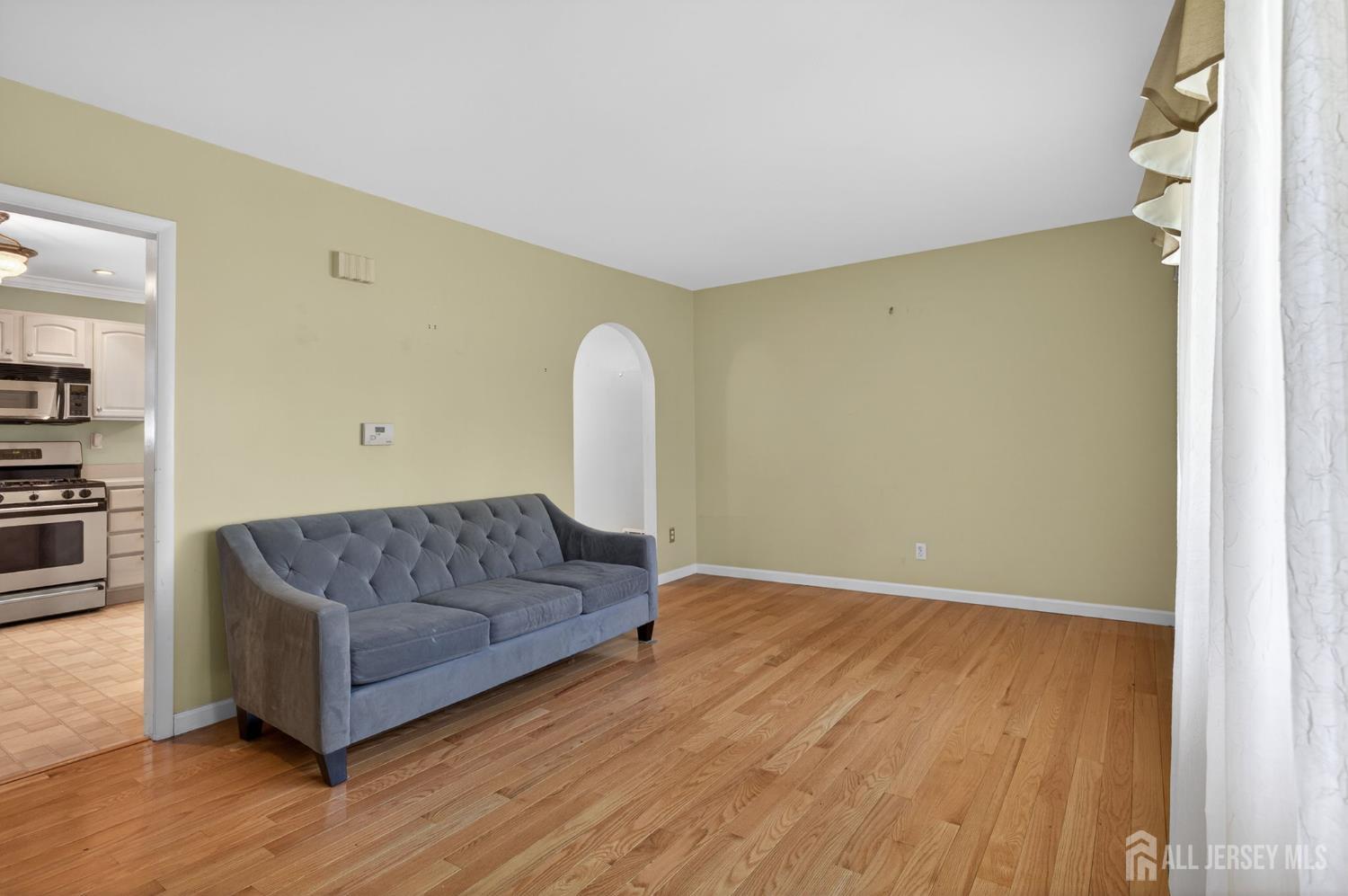 24 Moryan Road Edison, NJ 08817 - Photo 3 of 33 a living room with a couch and a fireplace