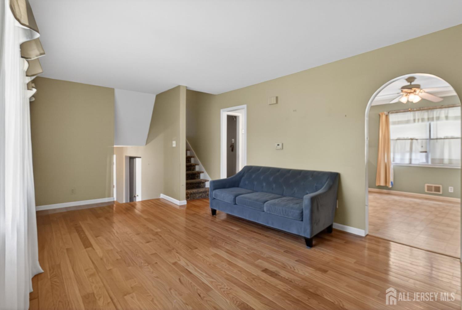 24 Moryan Road Edison, NJ 08817 - Photo 4 of 33 a living room with furniture and a large window
