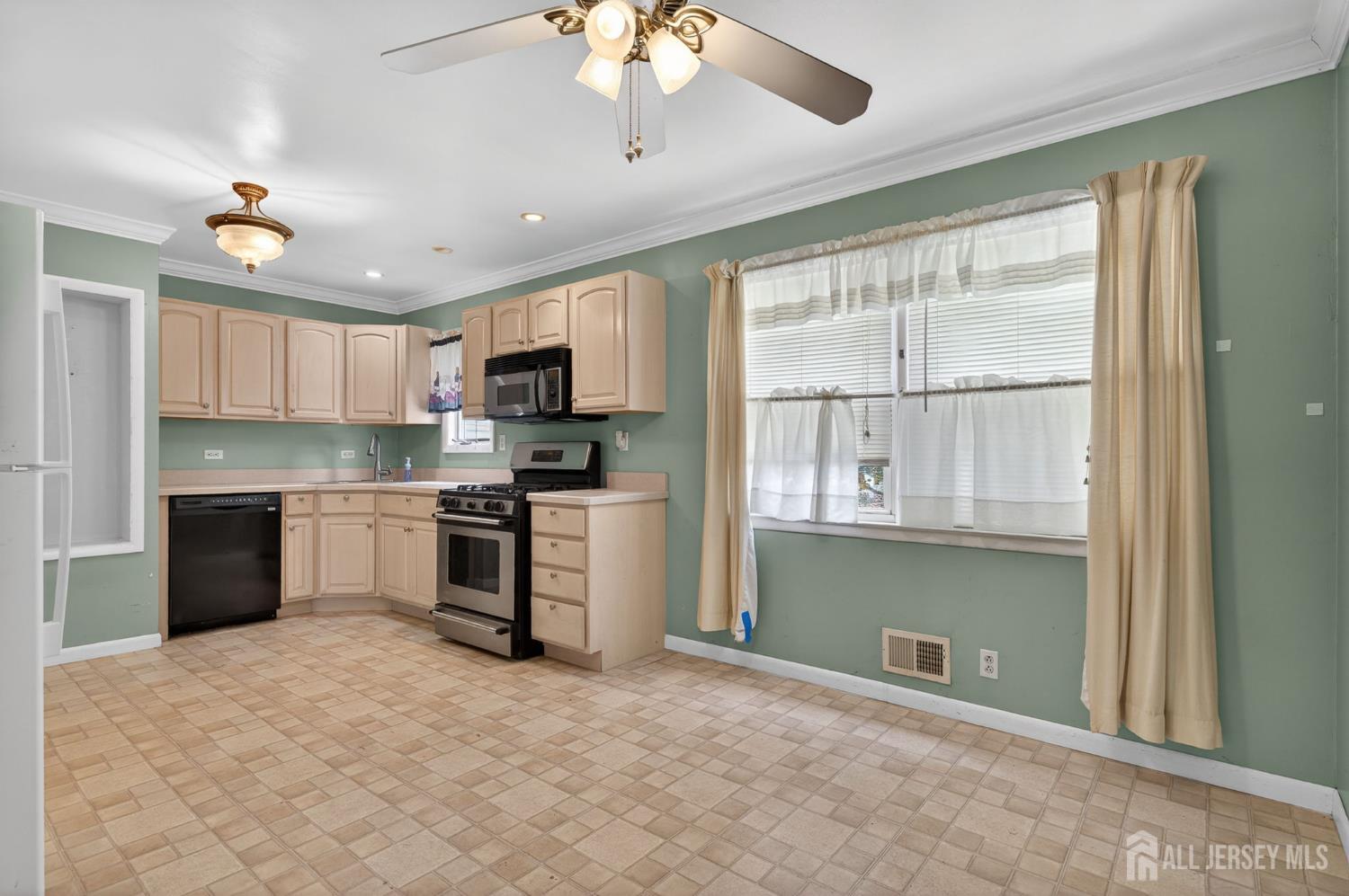 24 Moryan Road Edison, NJ 08817 - Photo 6 of 33 a kitchen with stainless steel appliances granite countertop a stove and a refrigerator