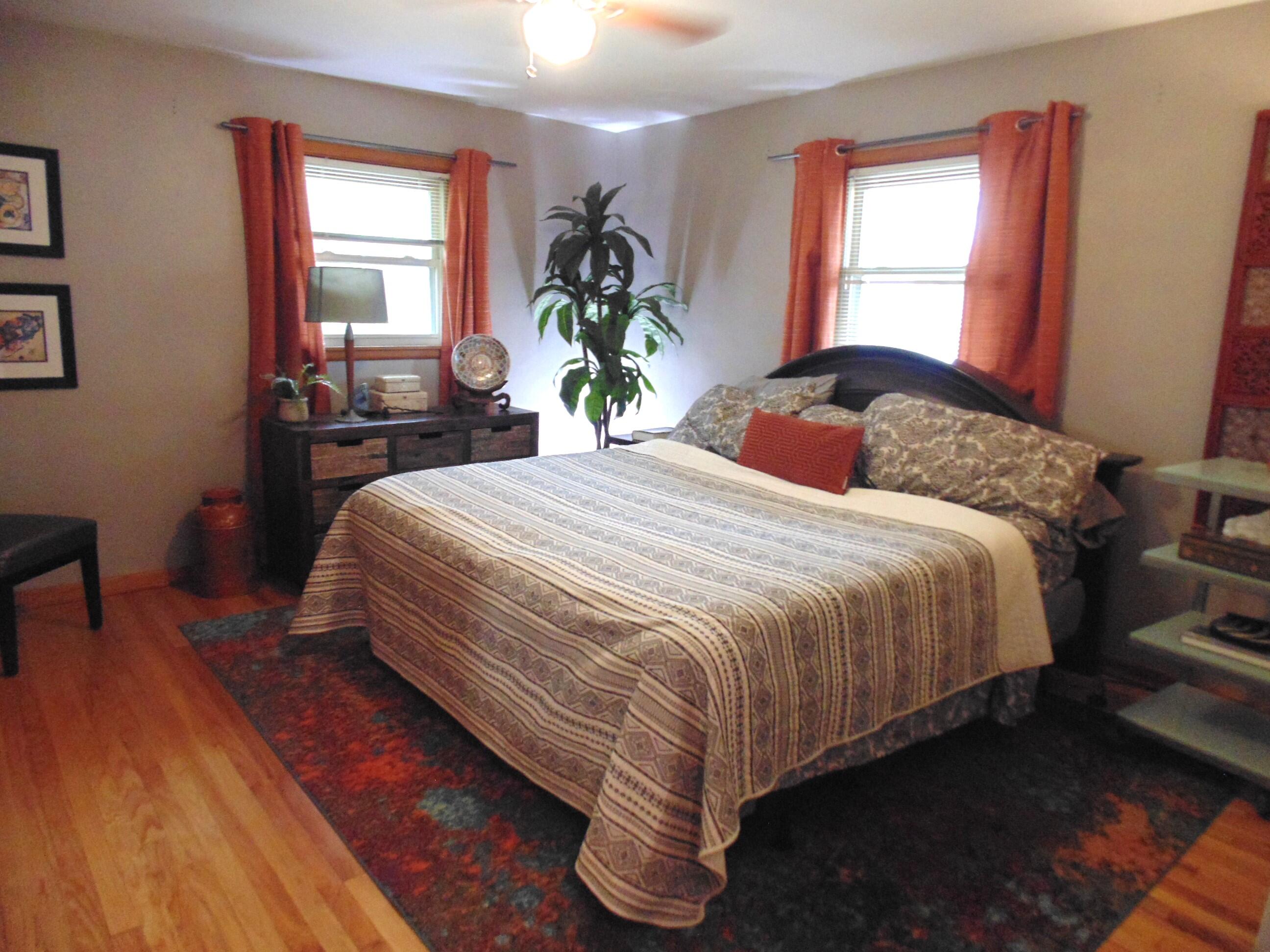 6801 Forest Avenue Gary, IN 46403 - Photo 12 of 23 a bedroom with a bed and wooden floor