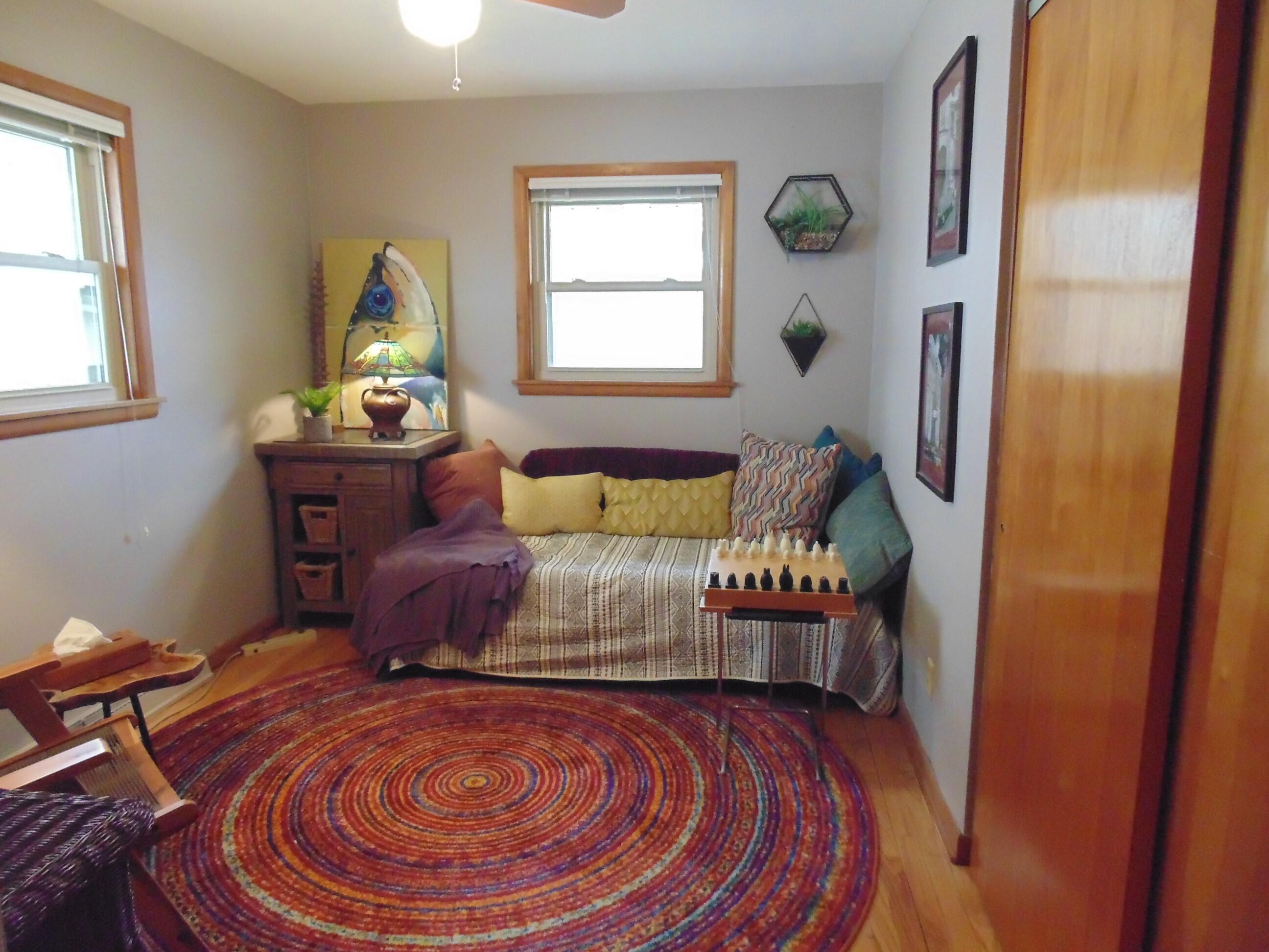 6801 Forest Avenue Gary, IN 46403 - Photo 13 of 23 a bed sitting in a bedroom next to a window
