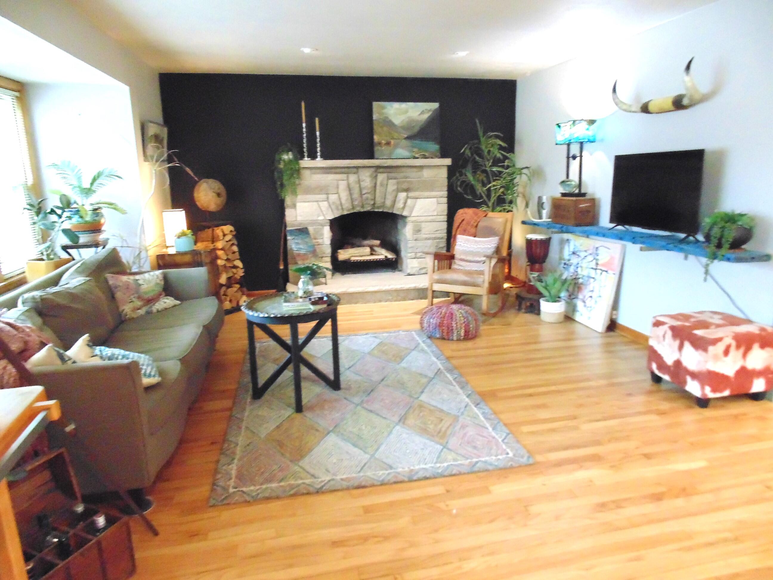 6801 Forest Avenue Gary, IN 46403 - Photo 4 of 23 a living room with furniture a flat screen tv and a fireplace