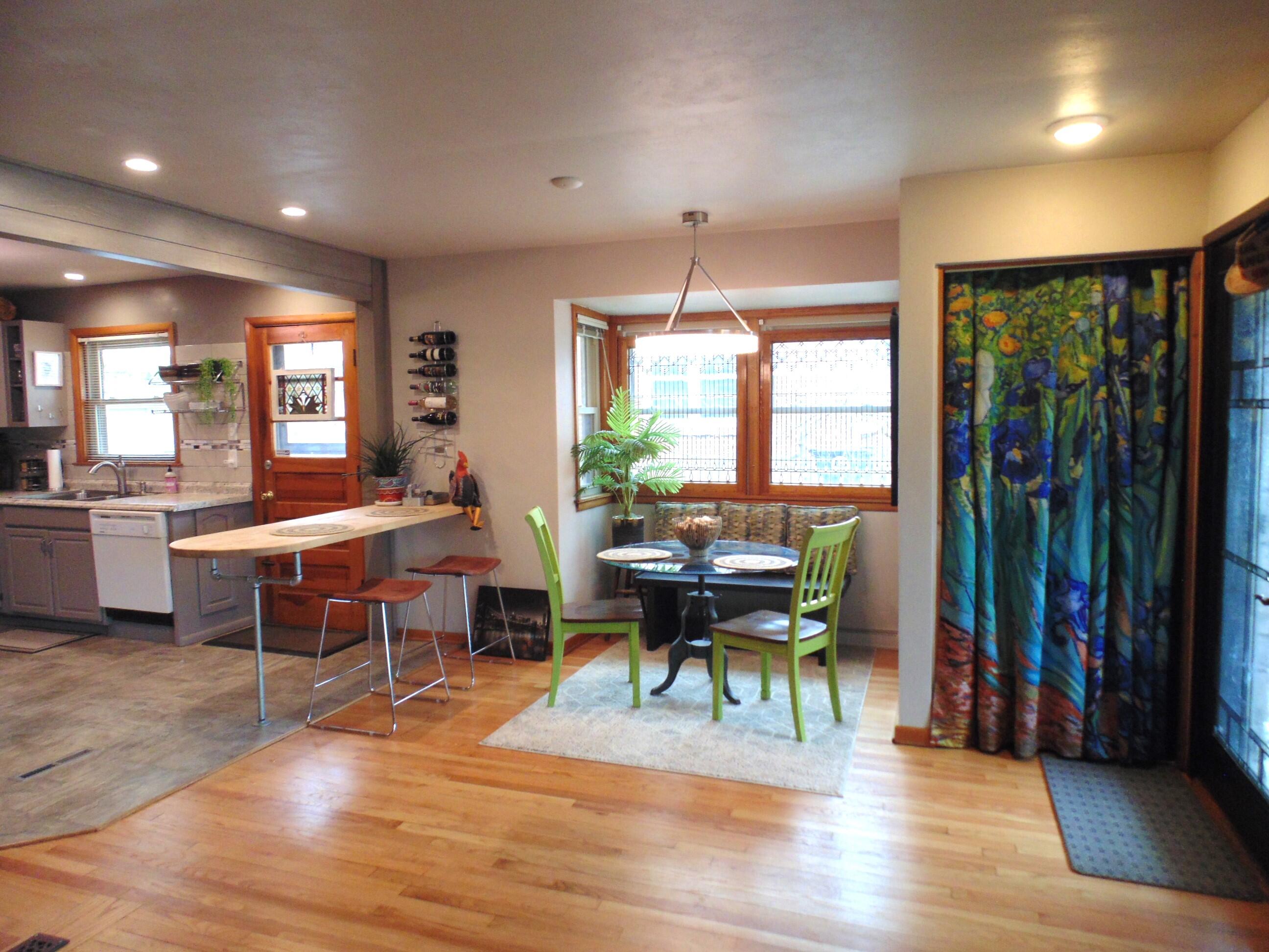 6801 Forest Avenue Gary, IN 46403 - Photo 6 of 23 a view of a dining room with furniture window and wooden floor