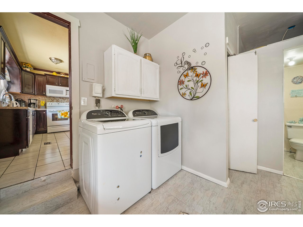 616 West Street Fort Morgan, CO 80701 - Photo 13 of 21 a kitchen with a refrigerator and a stove