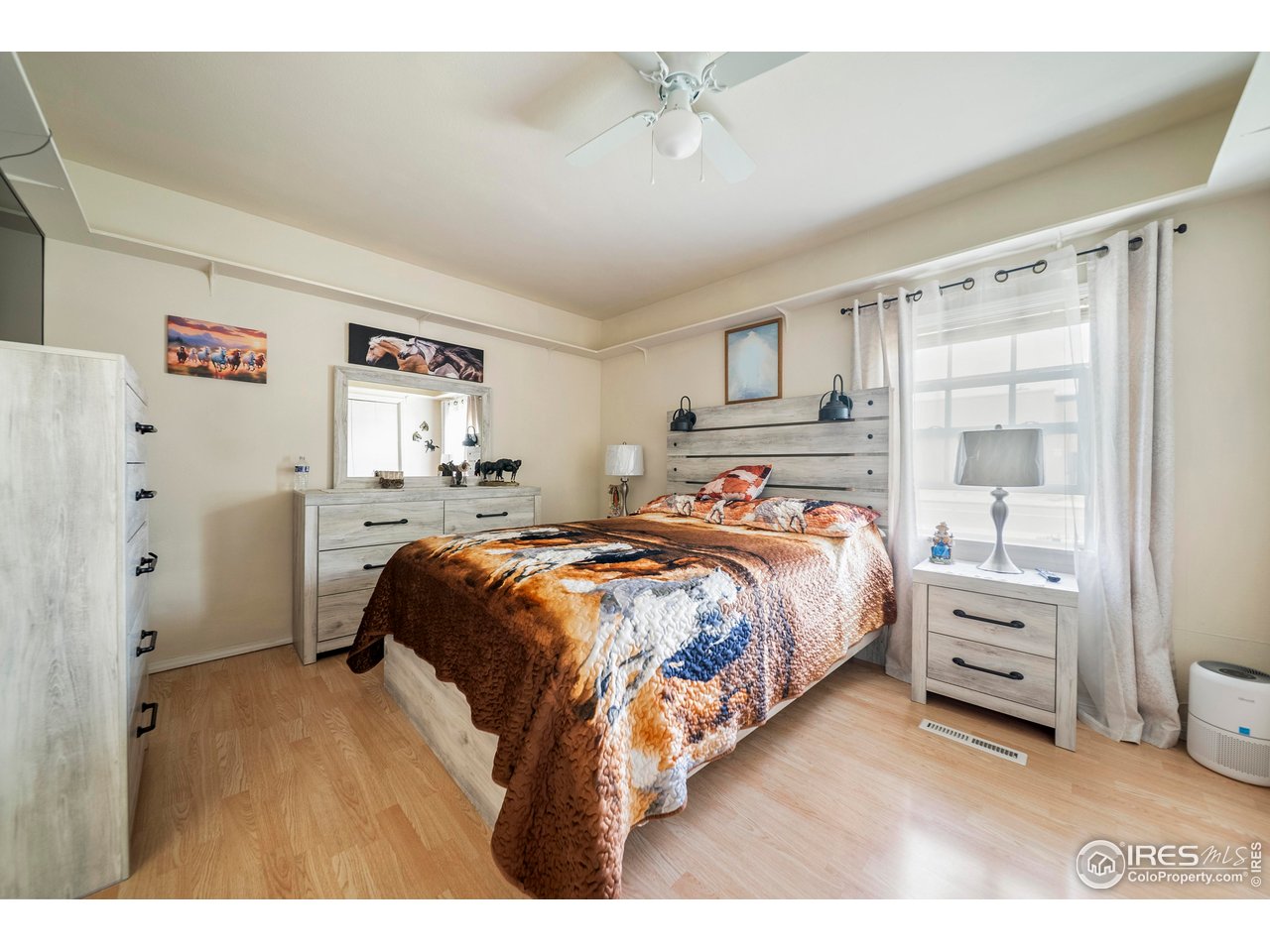 616 West Street Fort Morgan, CO 80701 - Photo 6 of 21 a bedroom with a bed and a window