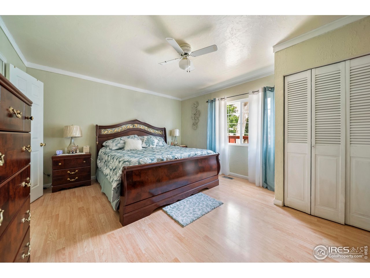 616 West Street Fort Morgan, CO 80701 - Photo 7 of 21 a bedroom with a bed and a night stand