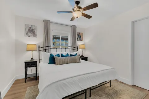 a bedroom with a bed and window