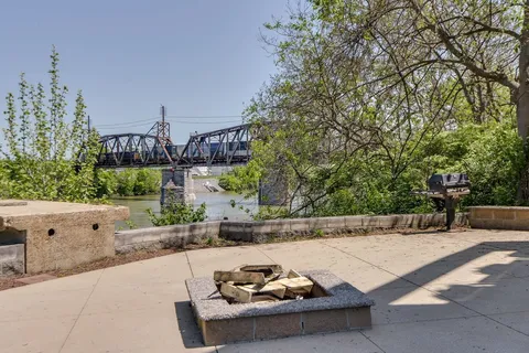 a view of a terrace with a bench and potted plants