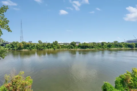 a view of a lake with a house in the background