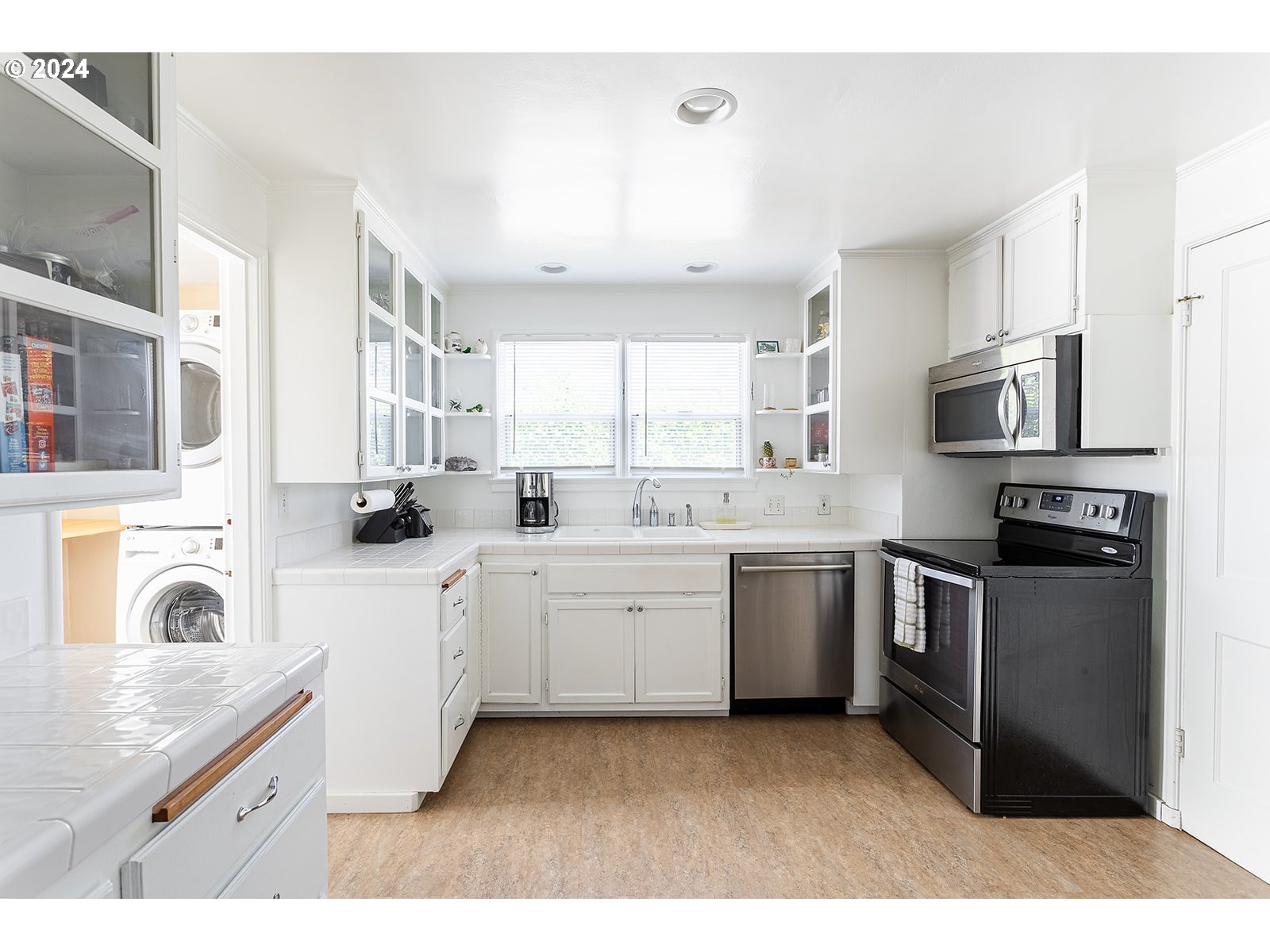 2275 Cal Young Road Eugene, OR 97401 - Photo 20 of 36 a kitchen with stainless steel appliances granite countertop a stove sink and cabinets