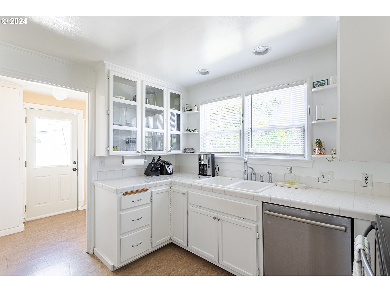 2275 Cal Young Road Eugene, OR 97401 - Photo 23 of 36 a kitchen with a sink window and cabinets