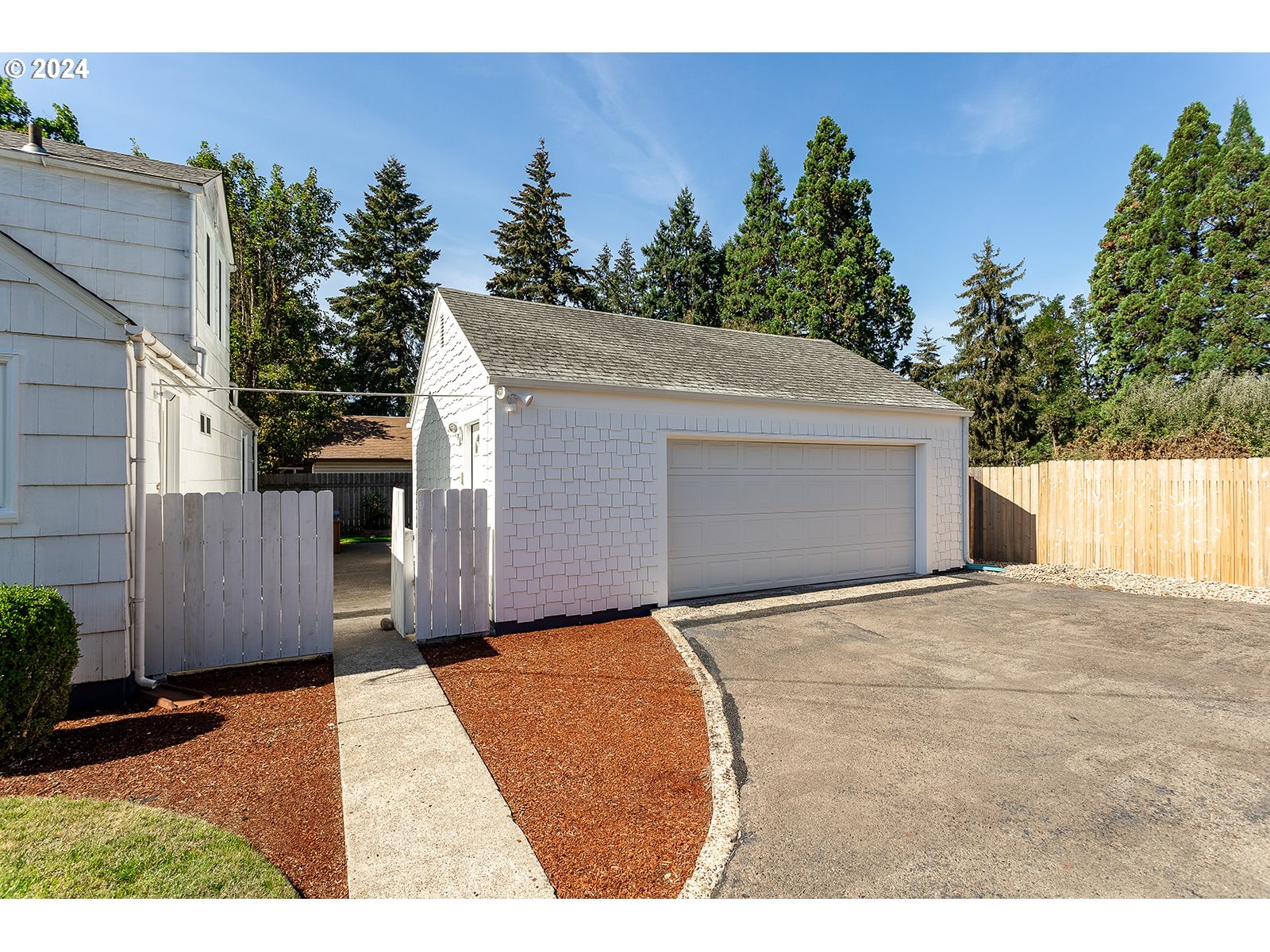 2275 Cal Young Road Eugene, OR 97401 - Photo 4 of 36 a backyard of a house with plants and trees