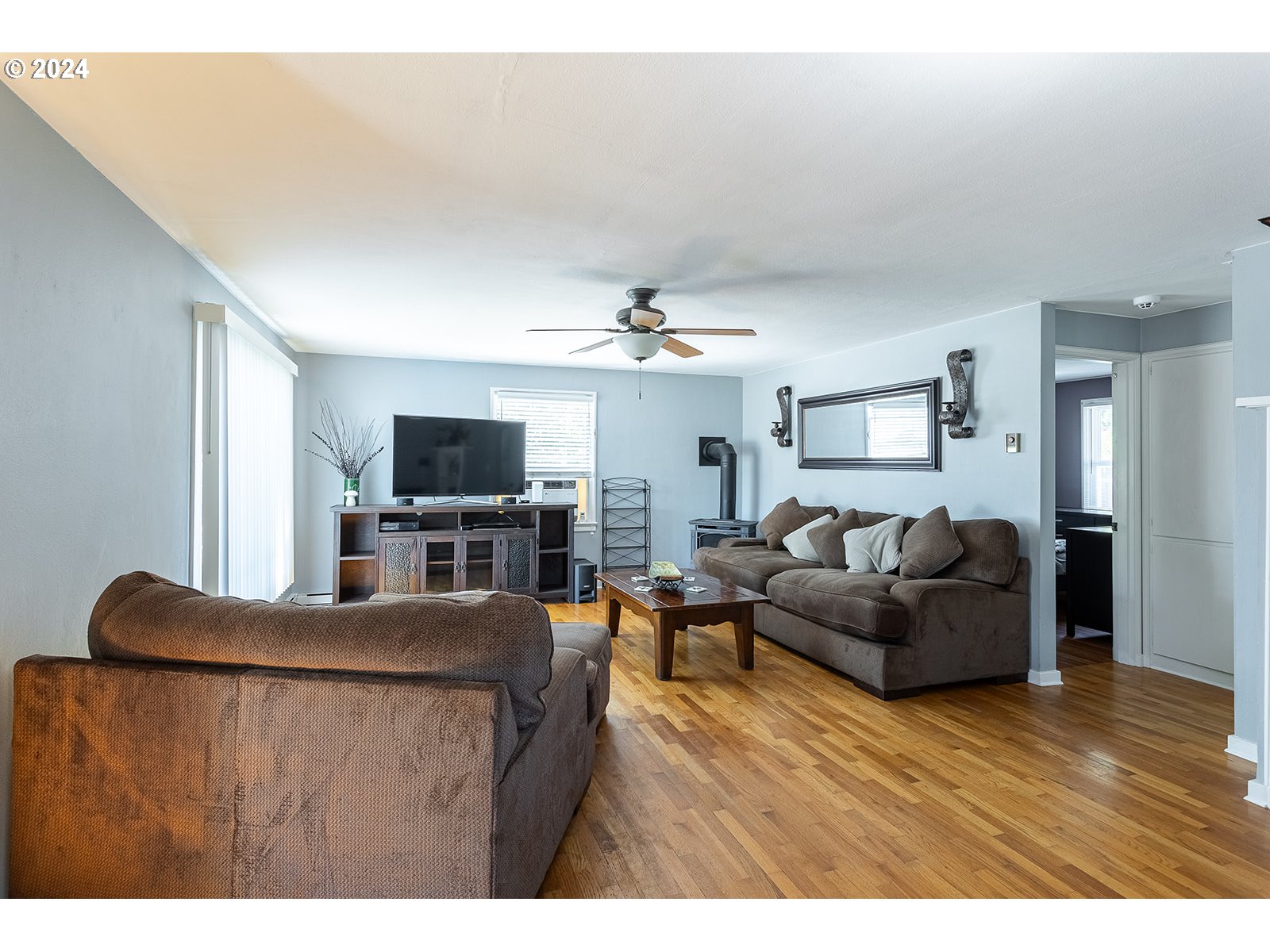 2275 Cal Young Road Eugene, OR 97401 - Photo 7 of 36 a living room with furniture and a flat screen tv