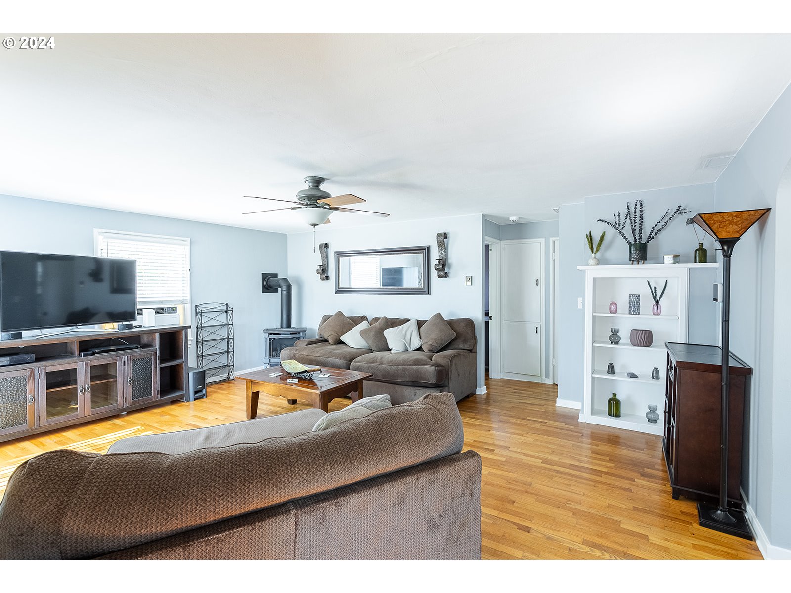 2275 Cal Young Road Eugene, OR 97401 - Photo 9 of 36 a living room with furniture and a flat screen tv