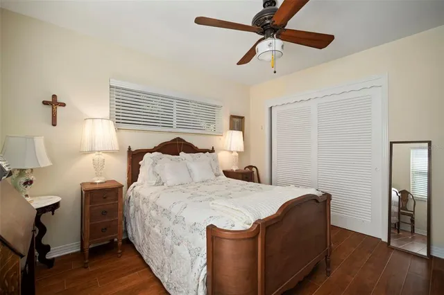 a spacious bedroom with a bed and a view of bathroom