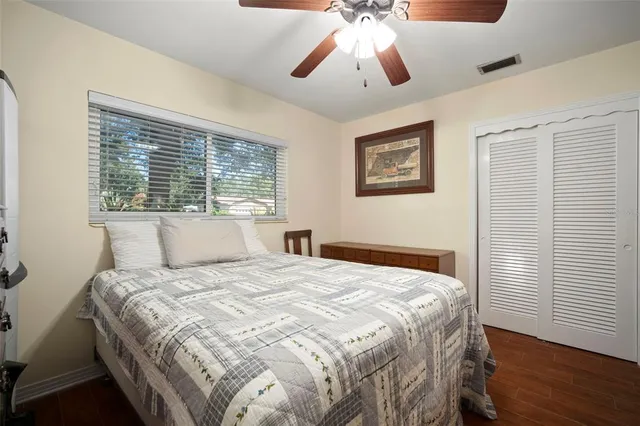a bathroom with a sink vanity mirror and toilet