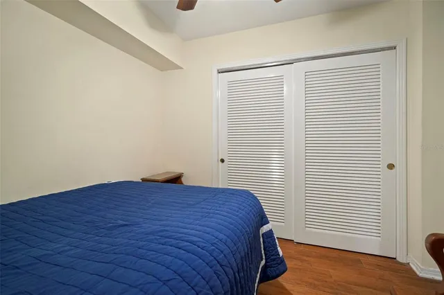 a view of a patio with table and chairs potted plants with wooden floor