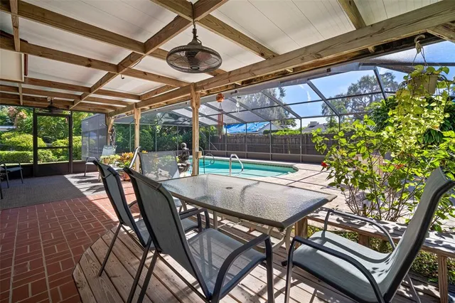 a view of a patio with a table and chairs