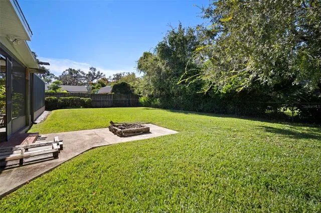 a view of a backyard with a garden and plants