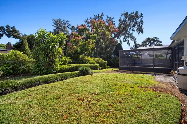 a front view of house with yard and outdoor seating