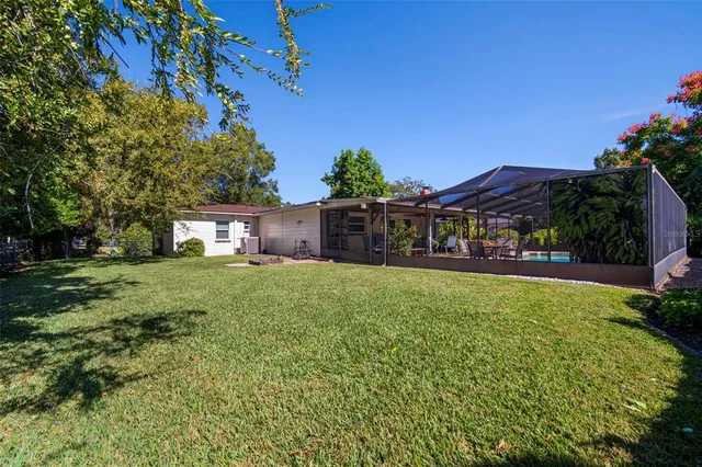 a house view with a backyard space