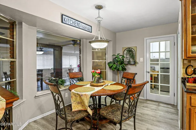 a view of a dining room with furniture and window