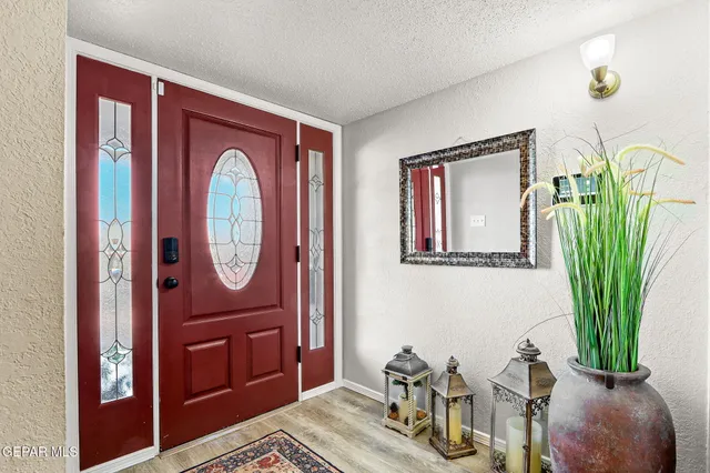 a view of a livingroom with furniture and a potted plant