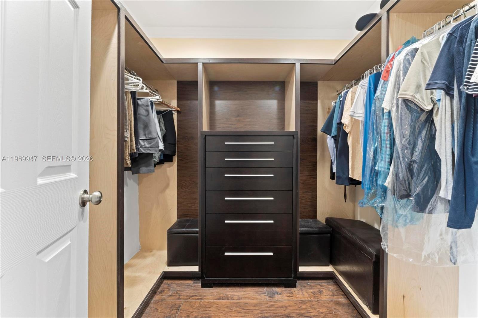 3370 Beau Rivage Drive, Unit B8 Pompano Beach, FL 33064 - Photo 13 of 33 a view of walk in closet with clothes and shoes