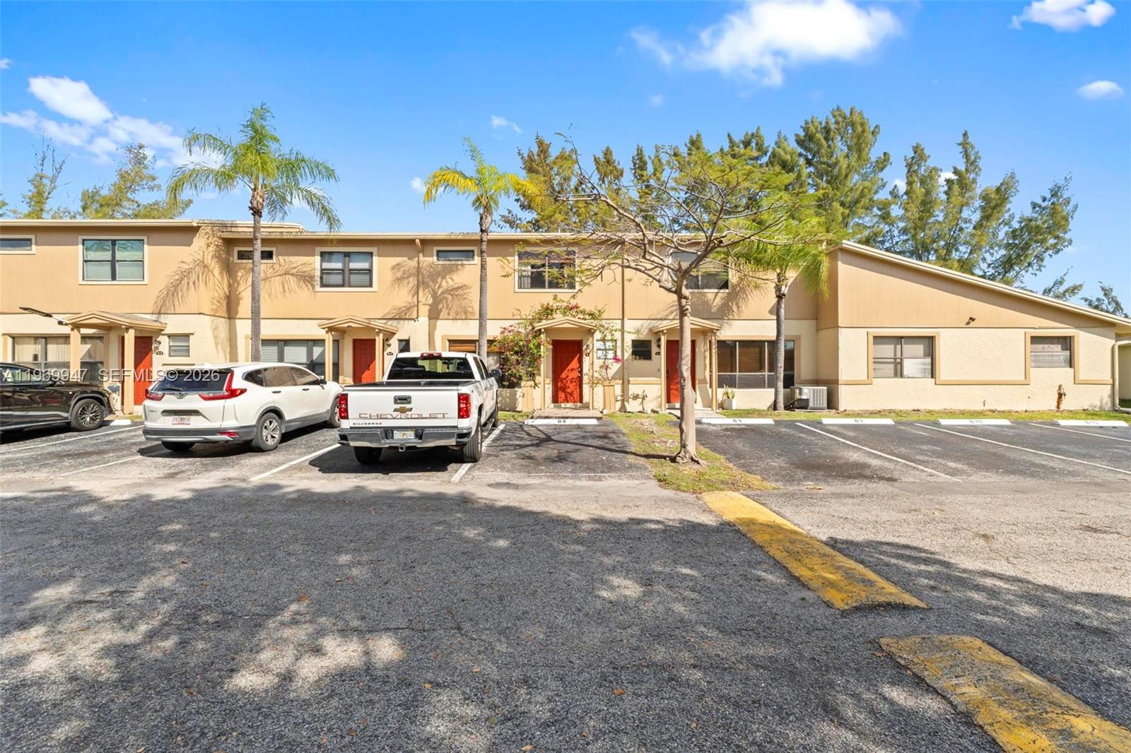 3370 Beau Rivage Drive, Unit B8 Pompano Beach, FL 33064 - Photo 18 of 33 a view of a car park in front of a building