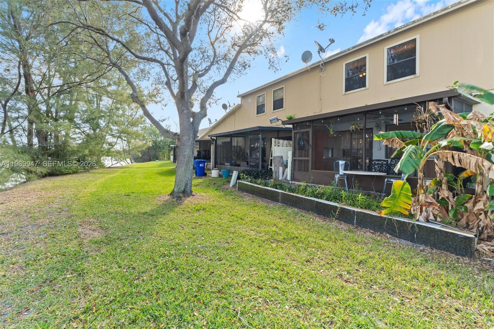 3370 Beau Rivage Drive, Unit B8 Pompano Beach, FL 33064 - Photo 20 of 33 a view of a house with backyard and sitting area
