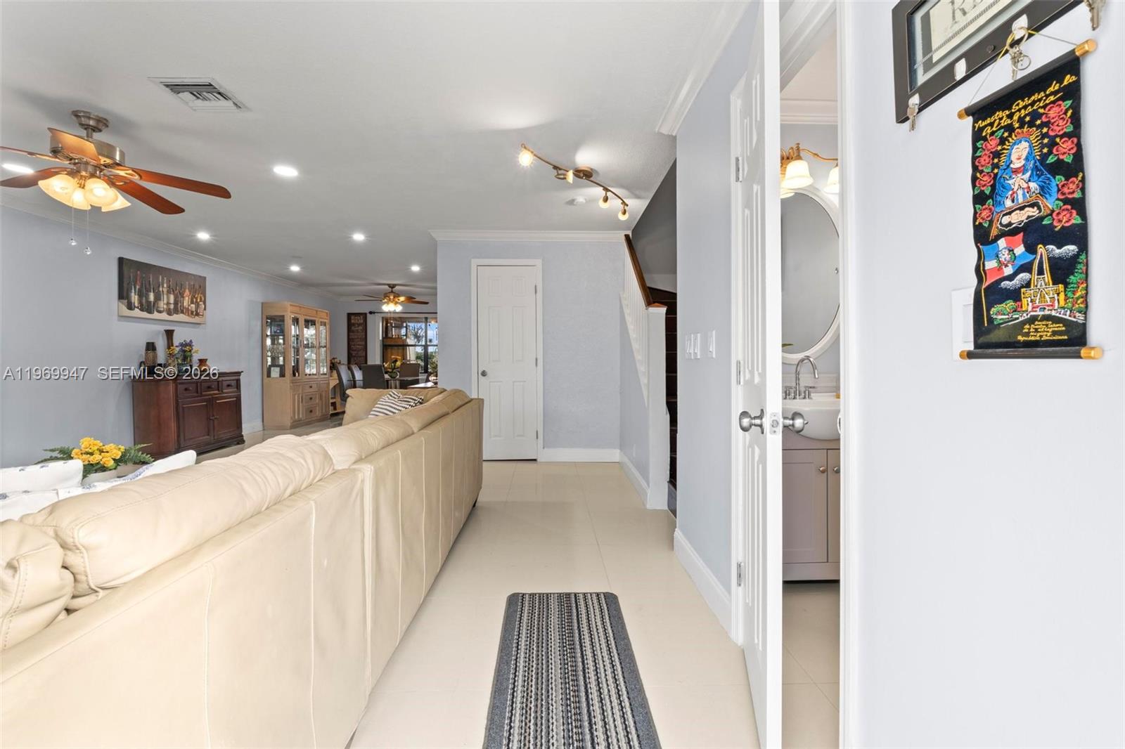 3370 Beau Rivage Drive, Unit B8 Pompano Beach, FL 33064 - Photo 23 of 33 a view of a hallway with dining table and chairs