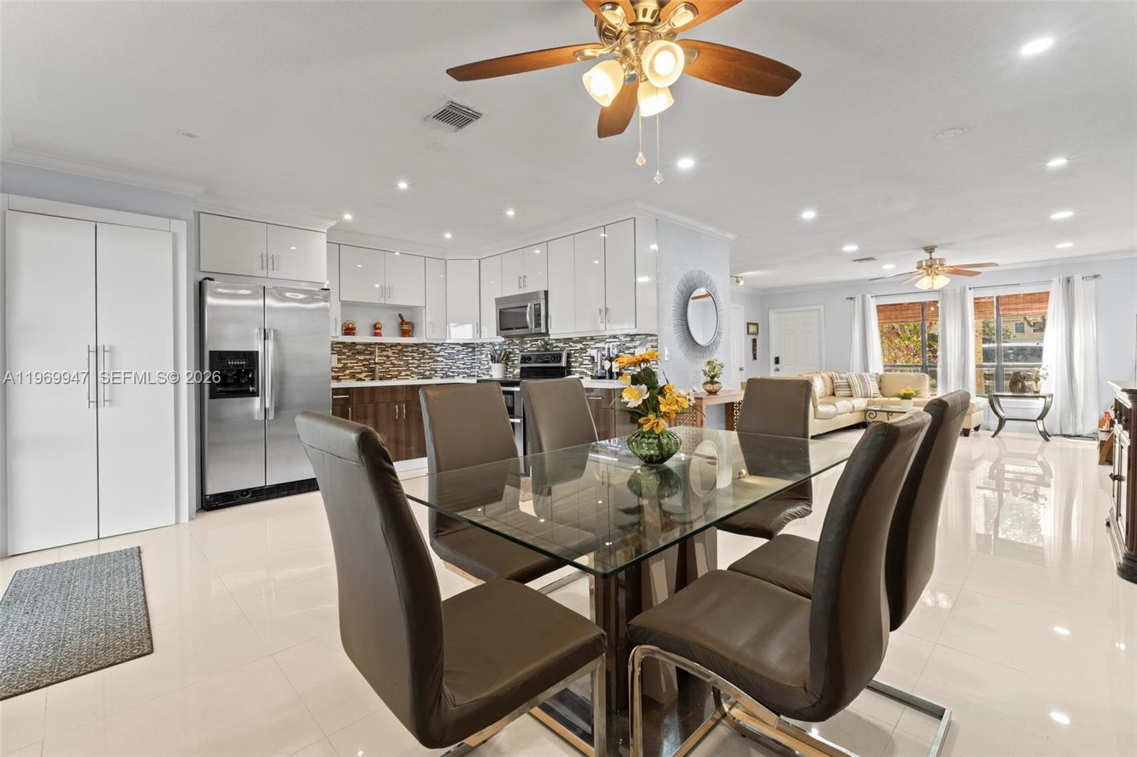 3370 Beau Rivage Drive, Unit B8 Pompano Beach, FL 33064 - Photo 26 of 33 a view of a dining area with furniture