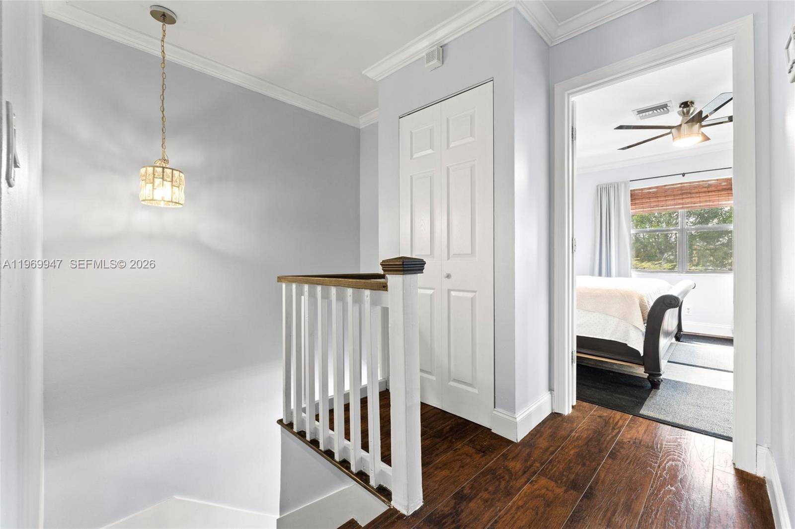 3370 Beau Rivage Drive, Unit B8 Pompano Beach, FL 33064 - Photo 28 of 33 a view of a hallway with wooden floor and a window