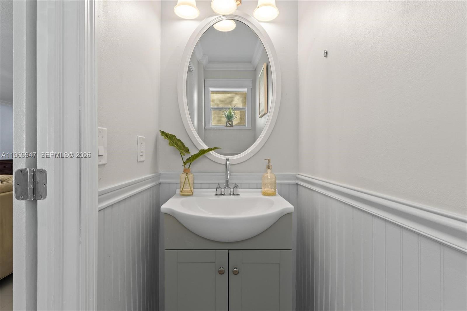 3370 Beau Rivage Drive, Unit B8 Pompano Beach, FL 33064 - Photo 30 of 33 a bathroom with a sink and a mirror