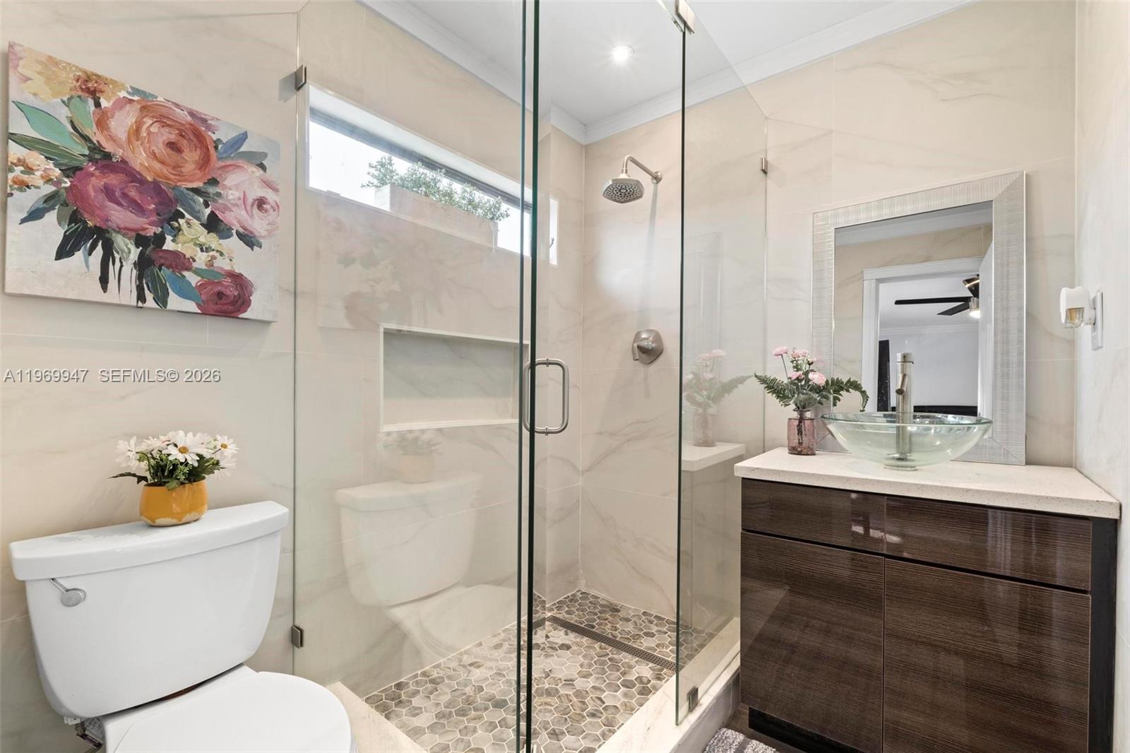 3370 Beau Rivage Drive, Unit B8 Pompano Beach, FL 33064 - Photo 4 of 33 a bathroom with a toilet sink and shower